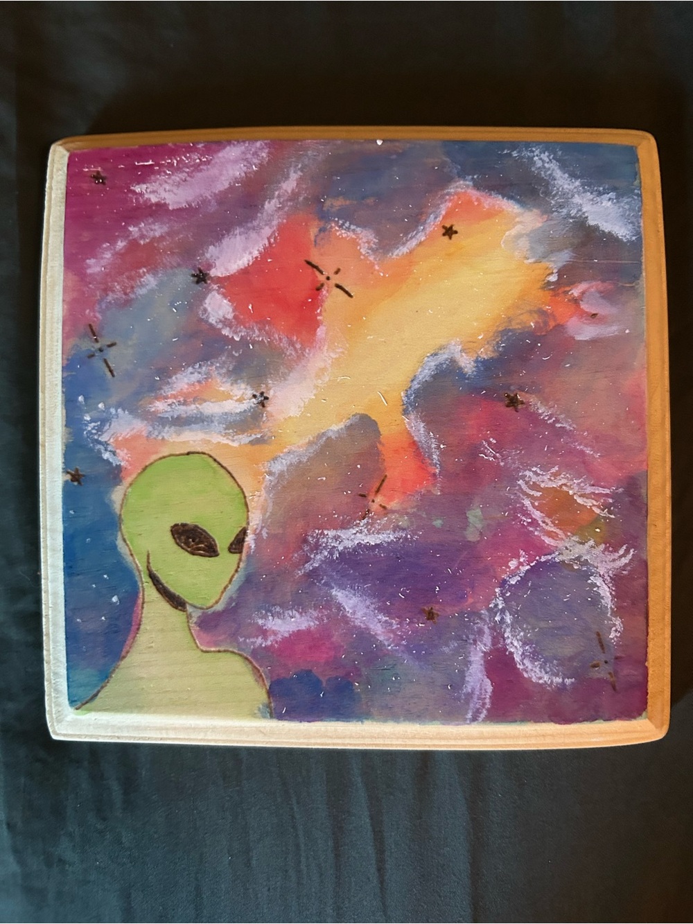 Hand-Painted and wood burned alien in space
